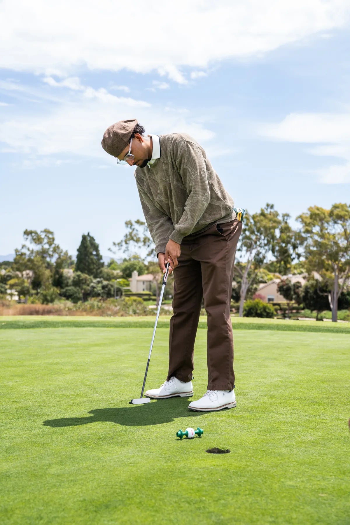 Putting on a practice green with the Line Lion set in front of the hole