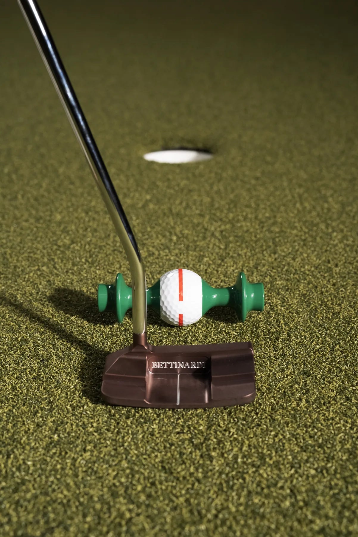 Putter face square behind the Line Lion, ready to roll the ball toward the hole